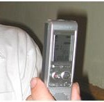 Photo of a recording device being held in someone's hand